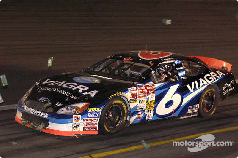 nascar-cup-charlotte-2002-mark-martin-takes-a-victory-lap-amidst-the-dollar-bills-after-wi.jpg